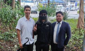 Fahmi arrested over post on Johor regent, cops seize phone