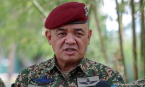 Former army chief, third wife plead not guilty to laundering over RM2m