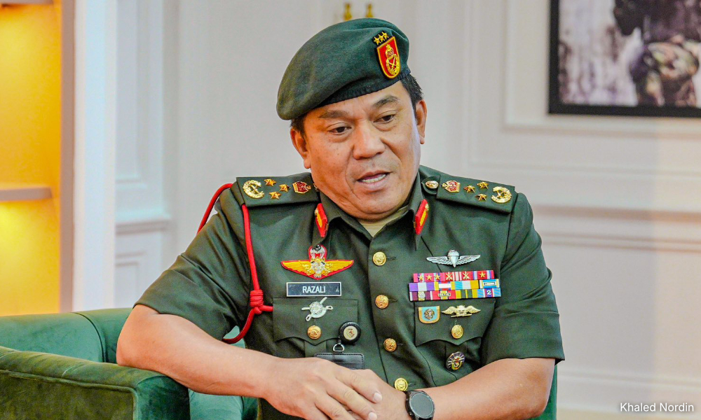 Ex-military spy chief charged with taking US$20k bribe, flight tickets for wife